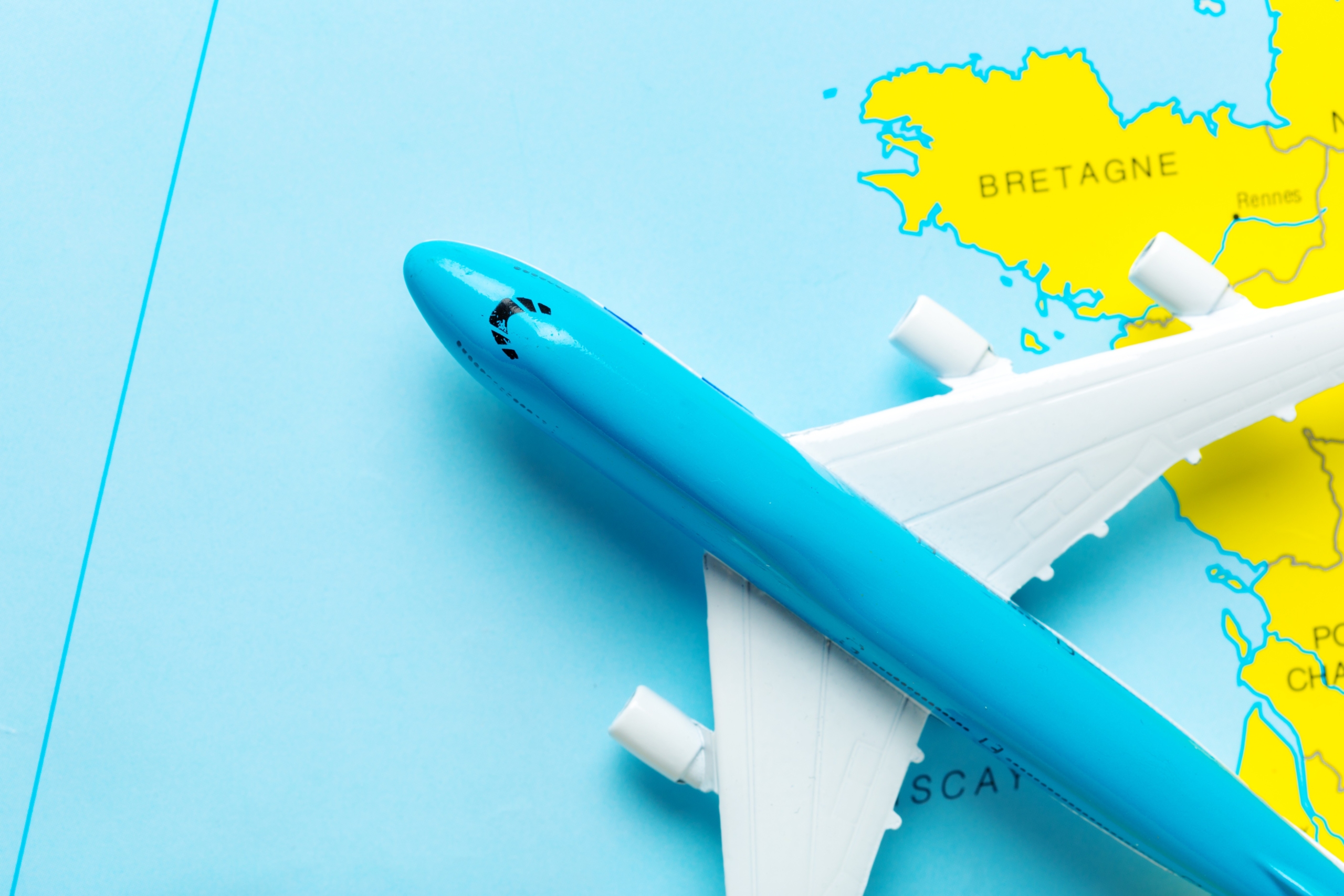 miniature of a passenger aircraft flying on a map